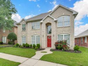McKinney property management - view of a two story house